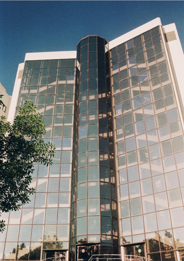 color image with photo of Tower B, inside NOVA FCSH campus