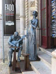 color image with photo of the Fado statue in the entrance of Rossio train station, Lisbon, Portugal